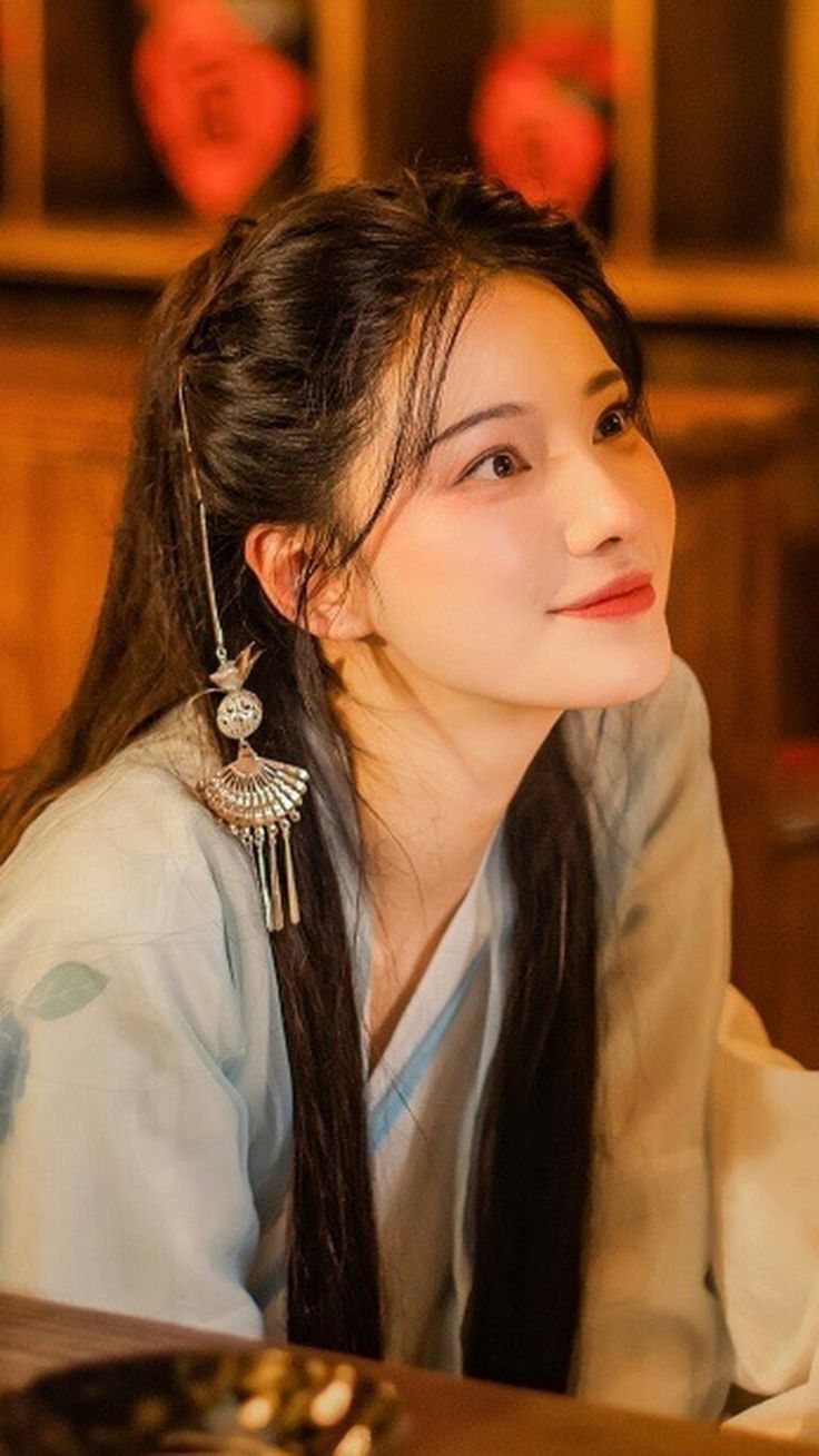 The Noble Elegance of Cheongsam and Fan The Noble Elegance of Cheongsam and Fan
